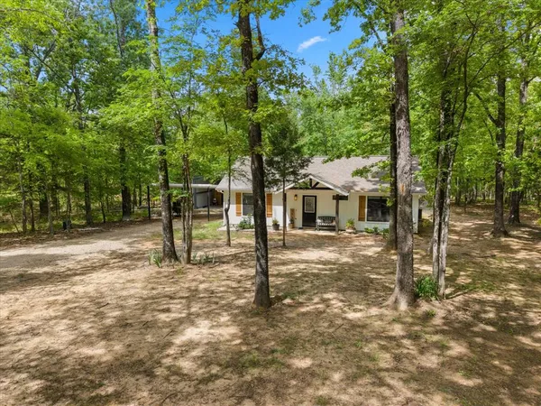 a view of a house with a tree