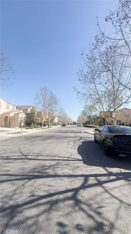 a view of street with a car parked on road