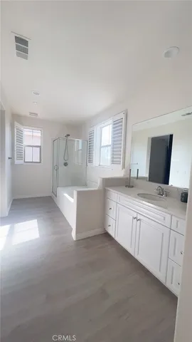 a white toilet sitting next to a bathroom sink
