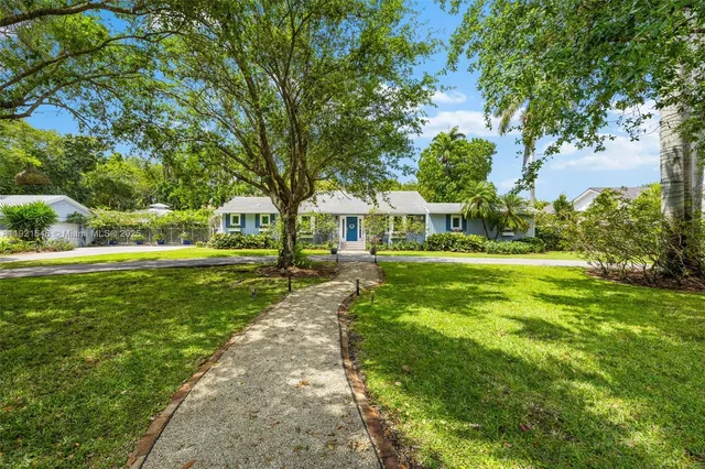 a view of a park with large trees