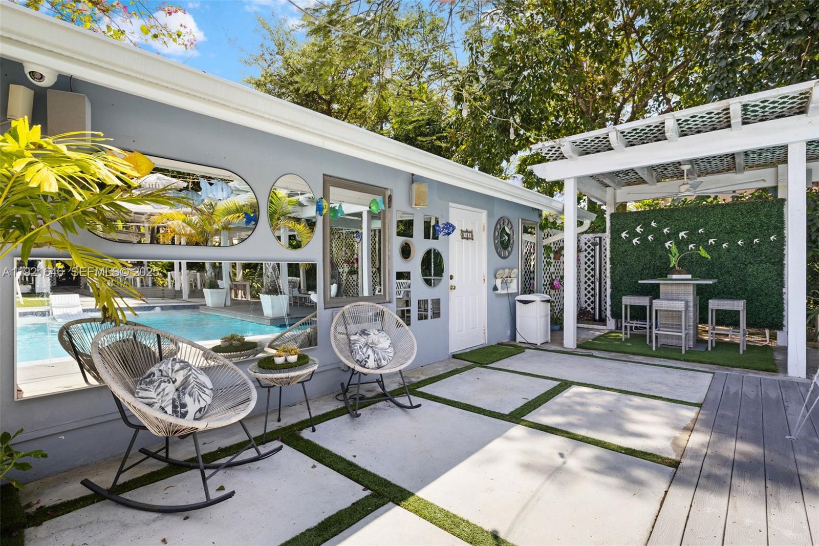 7720 Southwest 79th Court Miami, FL 33143 - Photo 15 of 58 a view of an chairs and tables in the patio