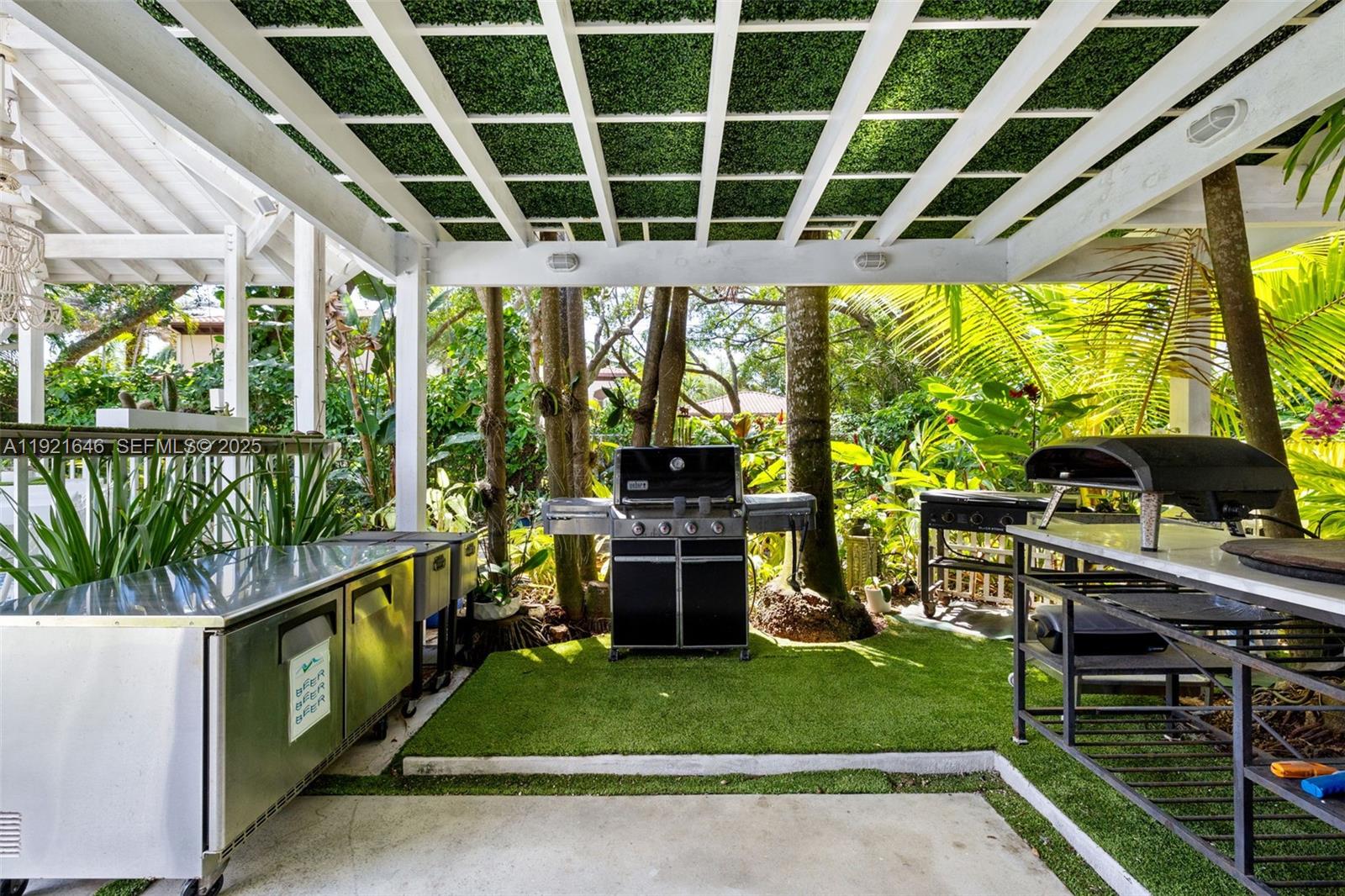 7720 Southwest 79th Court Miami, FL 33143 - Photo 17 of 58 a view of a porch with chairs and backyard