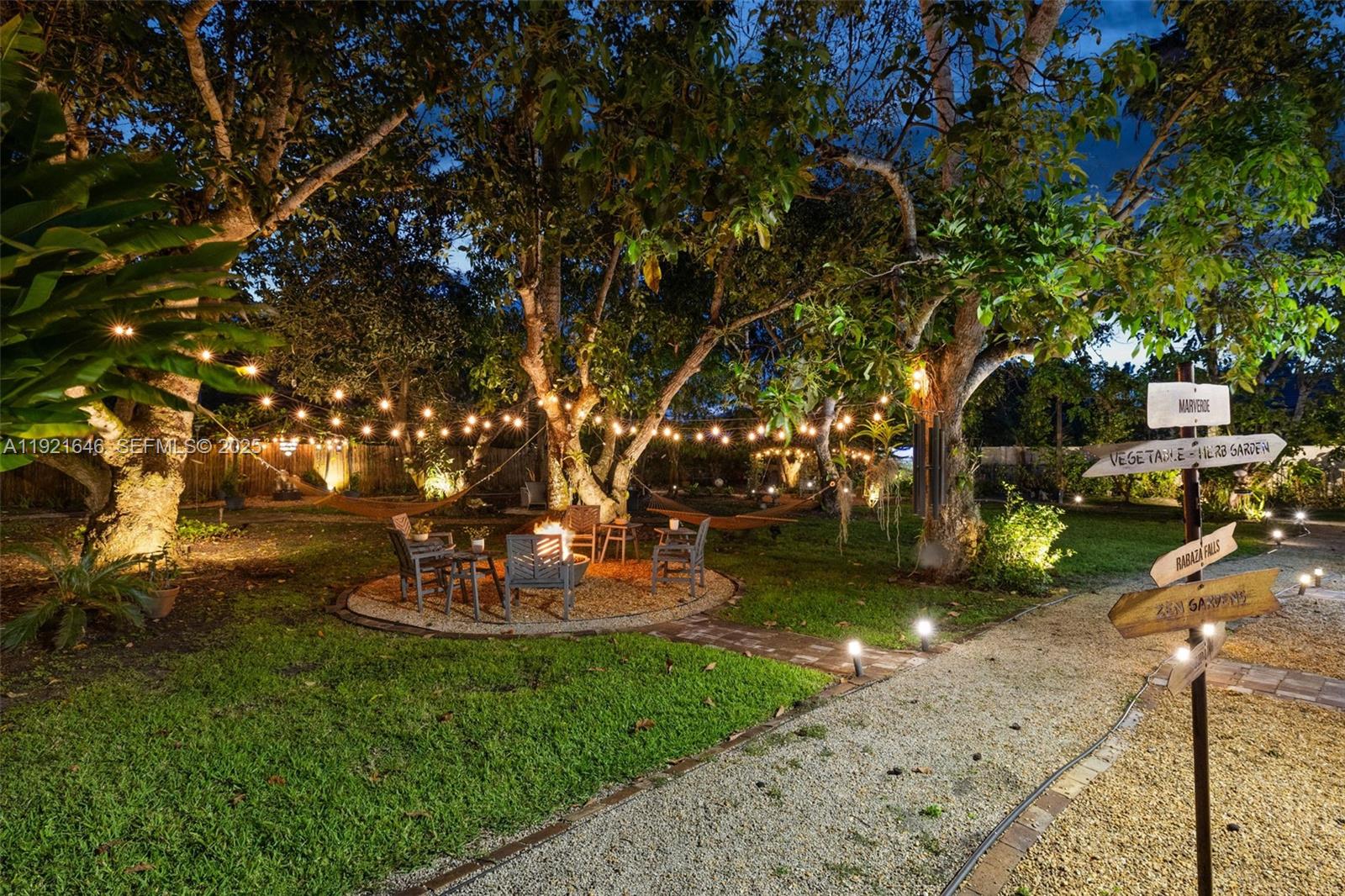 7720 Southwest 79th Court Miami, FL 33143 - Photo 22 of 58 a view of a yard with large trees