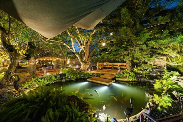 a living room with a large window and a table