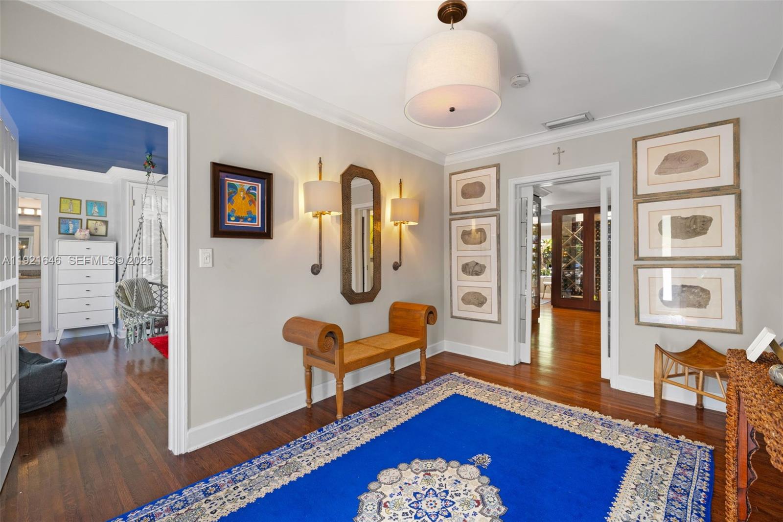 7720 Southwest 79th Court Miami, FL 33143 - Photo 29 of 58 a bedroom with furniture and wooden floor