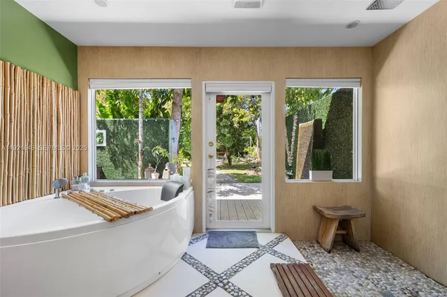 a view of a bedroom with furniture and wooden floor