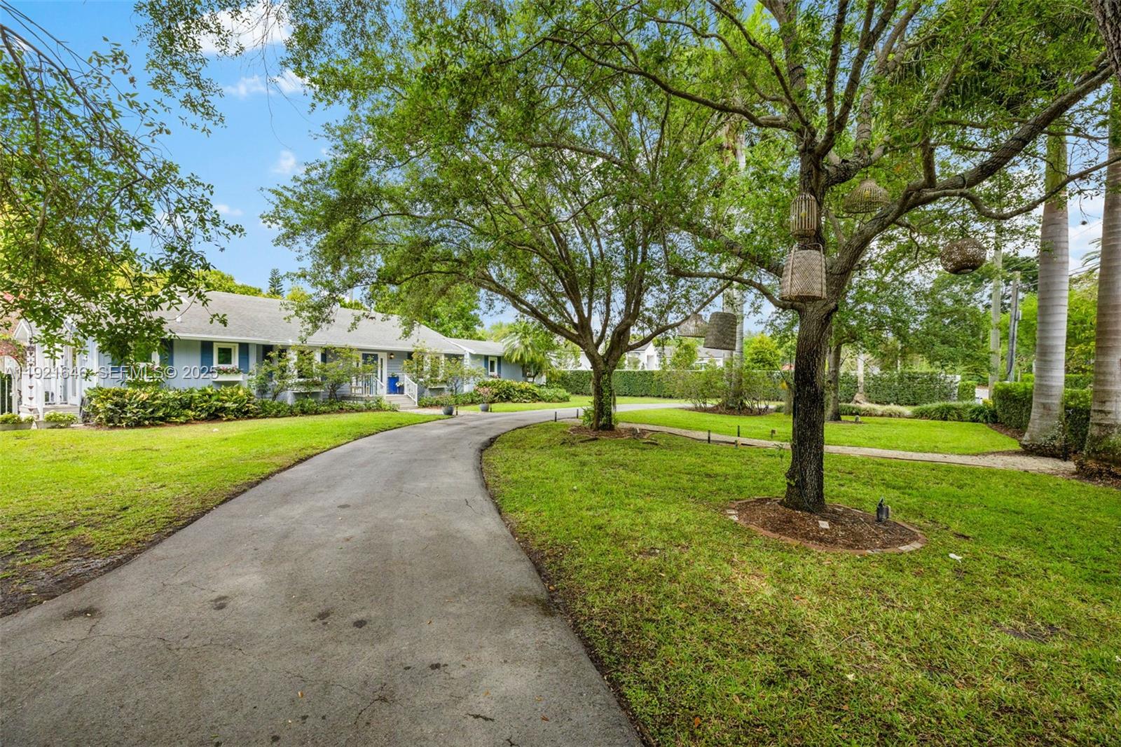 7720 Southwest 79th Court Miami, FL 33143 - Photo 3 of 58 a view of a house with a yard