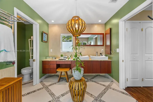 a bathroom with a toilet sink and tub