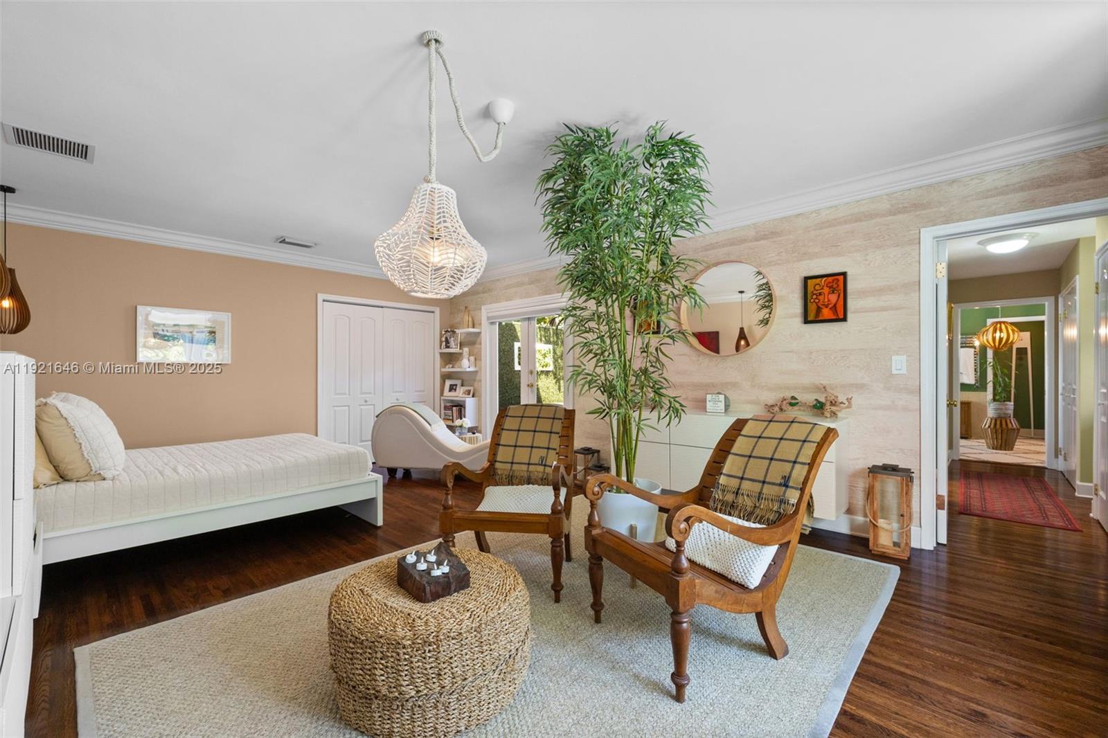 7720 Southwest 79th Court Miami, FL 33143 - Photo 35 of 58 a living room with furniture and a chandelier