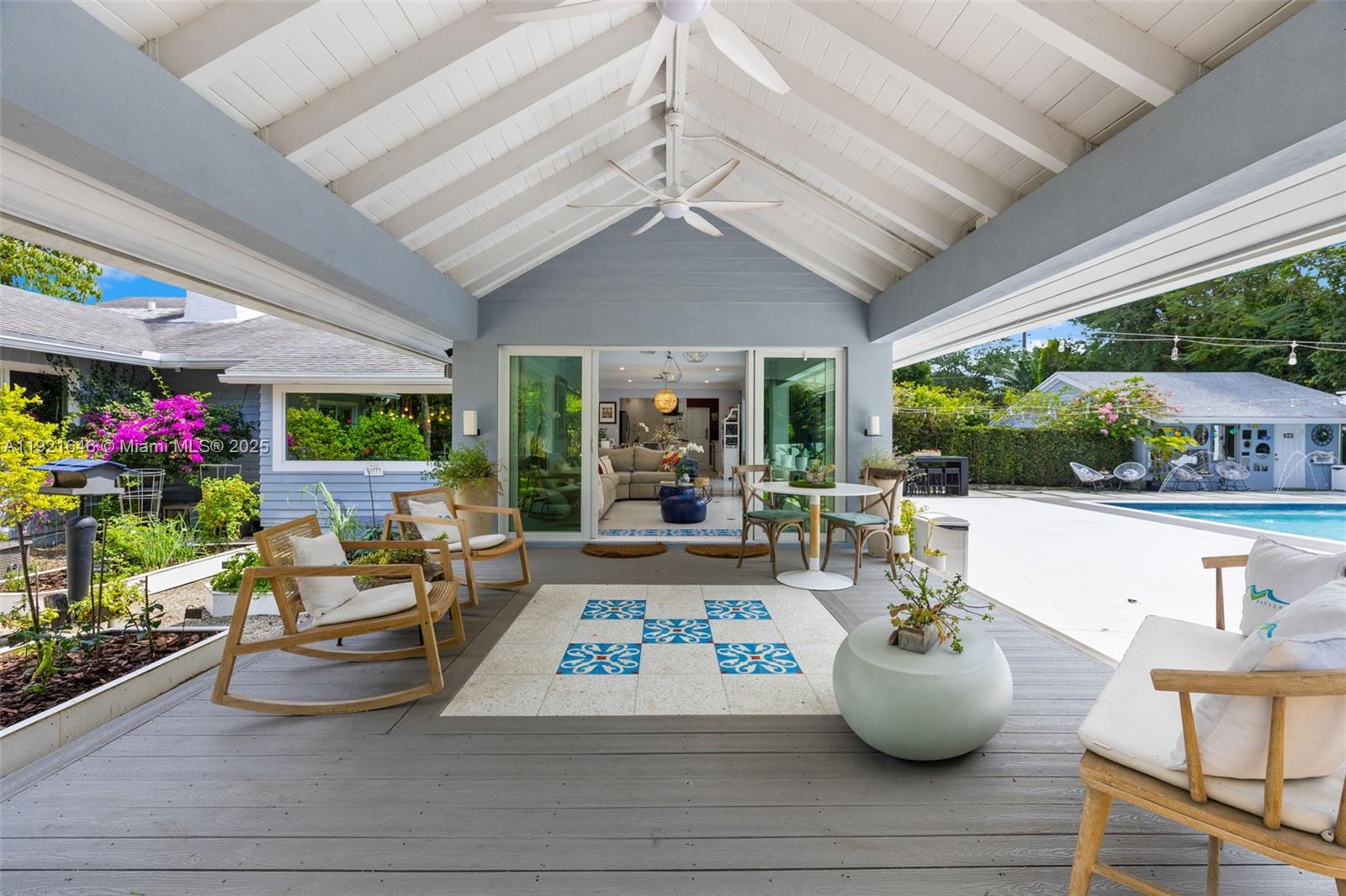 7720 Southwest 79th Court Miami, FL 33143 - Photo 7 of 58 a living room with patio furniture and a potted plant