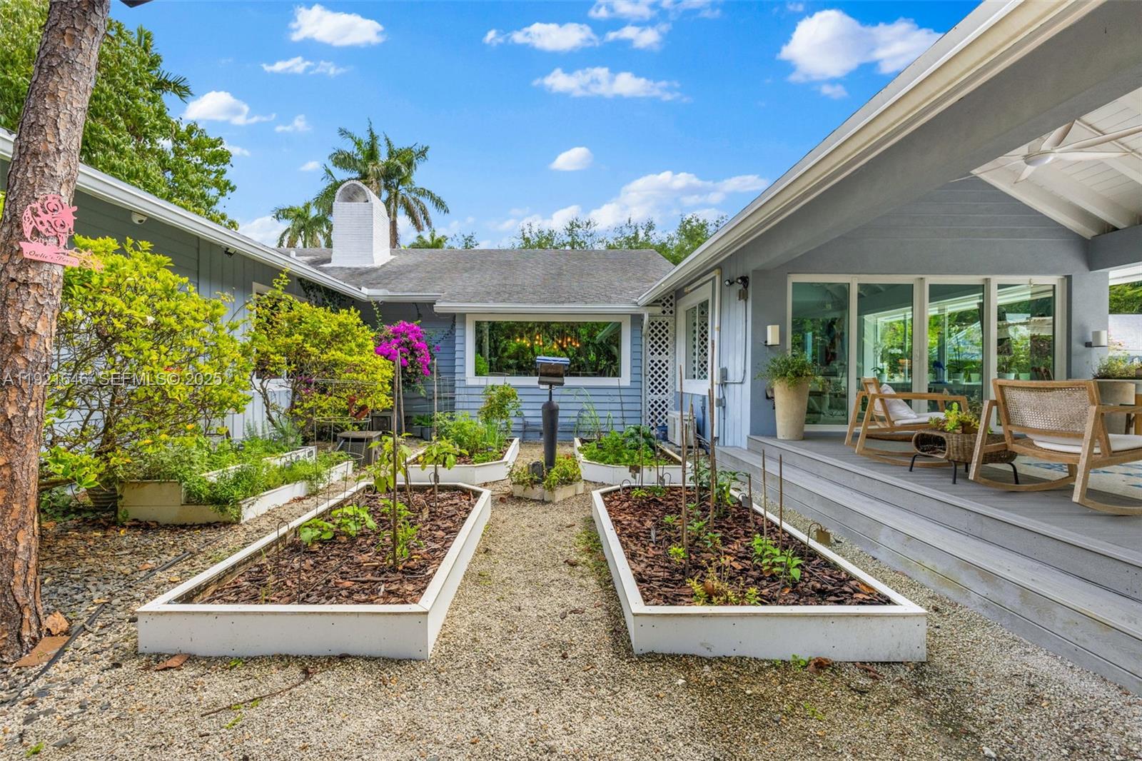 7720 Southwest 79th Court Miami, FL 33143 - Photo 9 of 58 a front view of a house with garden