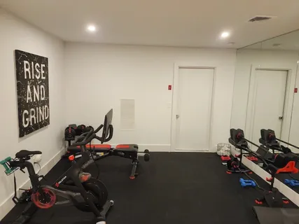 a living room with furniture window and a flat screen tv