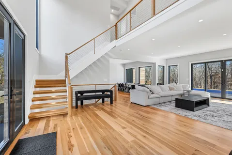 a living room with fireplace furniture and a flat screen tv