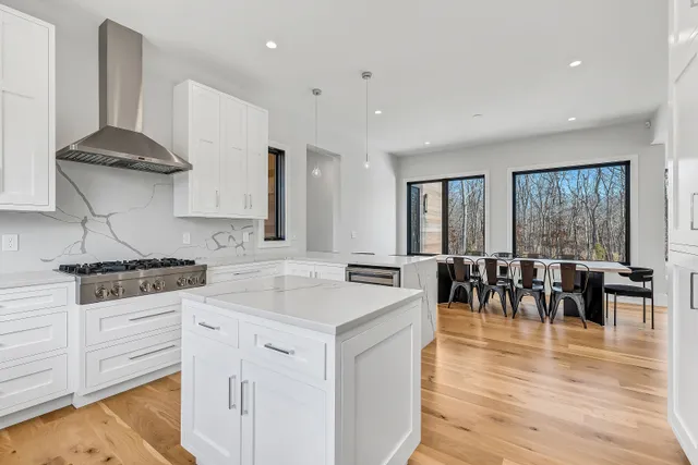 a kitchen with a stove a sink and a refrigerator
