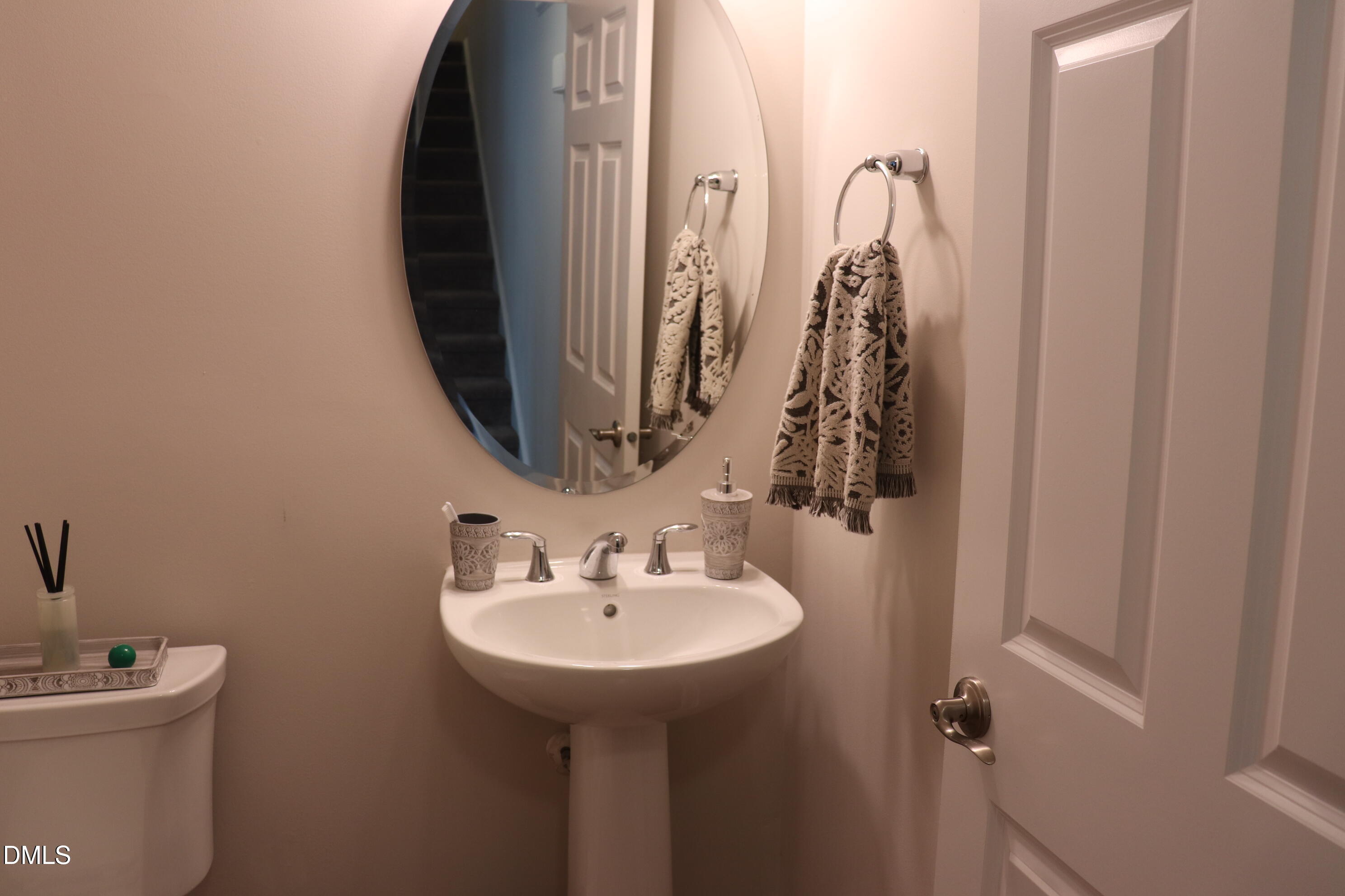 10510 Sablewood Drive, Unit 116 Raleigh, NC 27617 - Photo 21 of 47 a bathroom with a sink and mirror