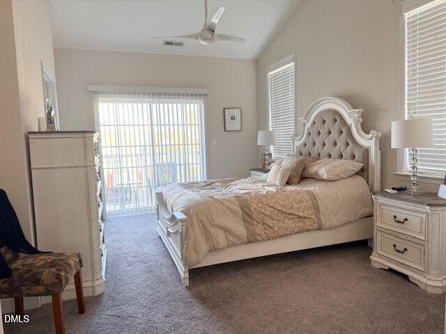 10510 Sablewood Drive, Unit 116 Raleigh, NC 27617 - Photo 22 of 47 a bedroom with a bed a couch and a large window