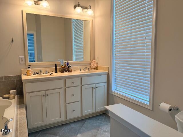 10510 Sablewood Drive, Unit 116 Raleigh, NC 27617 - Photo 26 of 47 a bathroom with a sink and a mirror