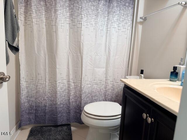 10510 Sablewood Drive, Unit 116 Raleigh, NC 27617 - Photo 30 of 47 a bathroom with a sink a toilet and shower curtain