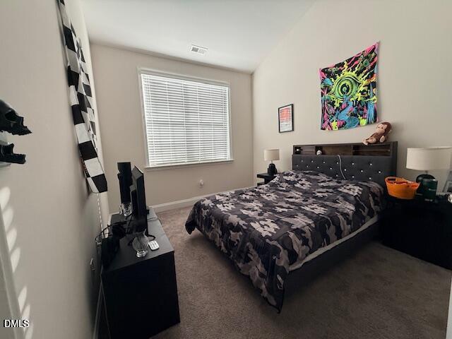 10510 Sablewood Drive, Unit 116 Raleigh, NC 27617 - Photo 32 of 47 a bed sitting in a bedroom next to a window