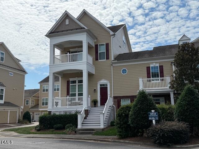 10510 Sablewood Drive, Unit 116 Raleigh, NC 27617 - Photo 4 of 47 a front view of a house with a yard