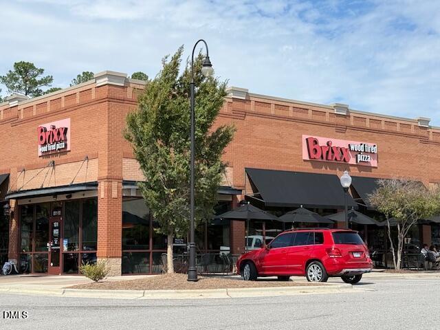 10510 Sablewood Drive, Unit 116 Raleigh, NC 27617 - Photo 46 of 47 a cafe on the corner of a building
