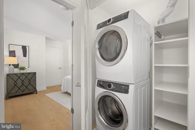 a view of a hallway with washer and dryer