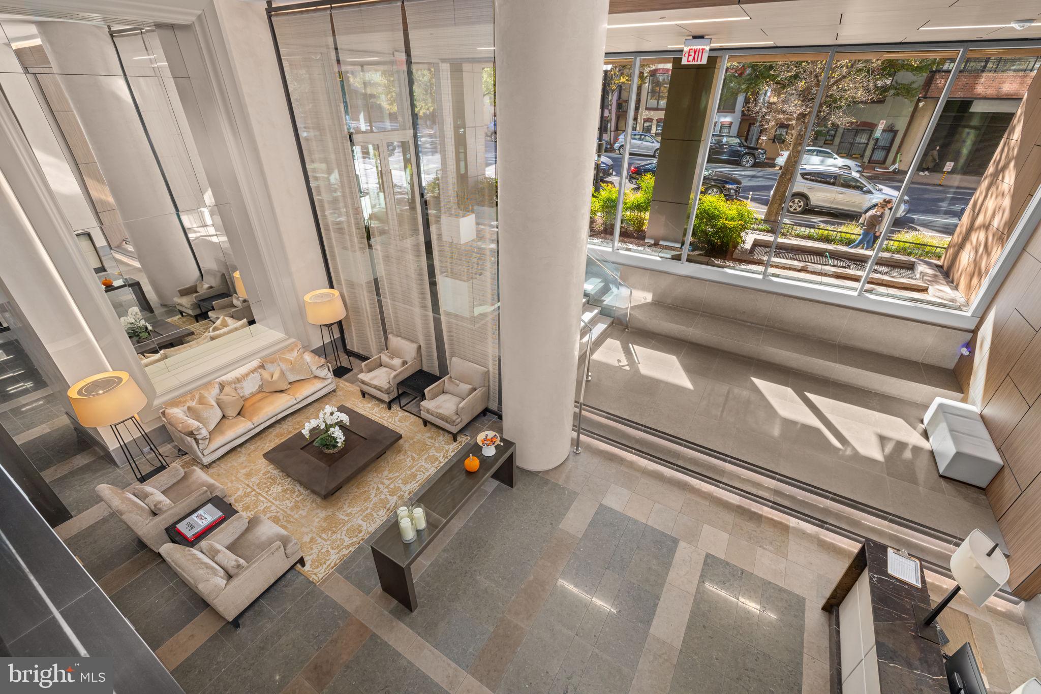 2501 M Street Northwest, Unit T04 Washington, DC 20037 - Photo 22 of 30 a living room with furniture and a window