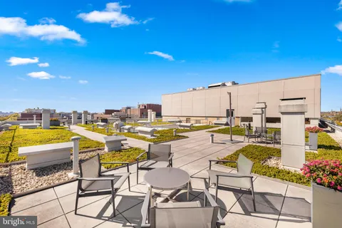 a view of a swimming pool with chairs