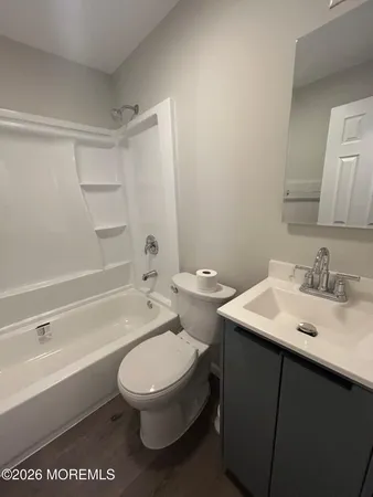 a bathroom with a toilet a sink and a bathtub