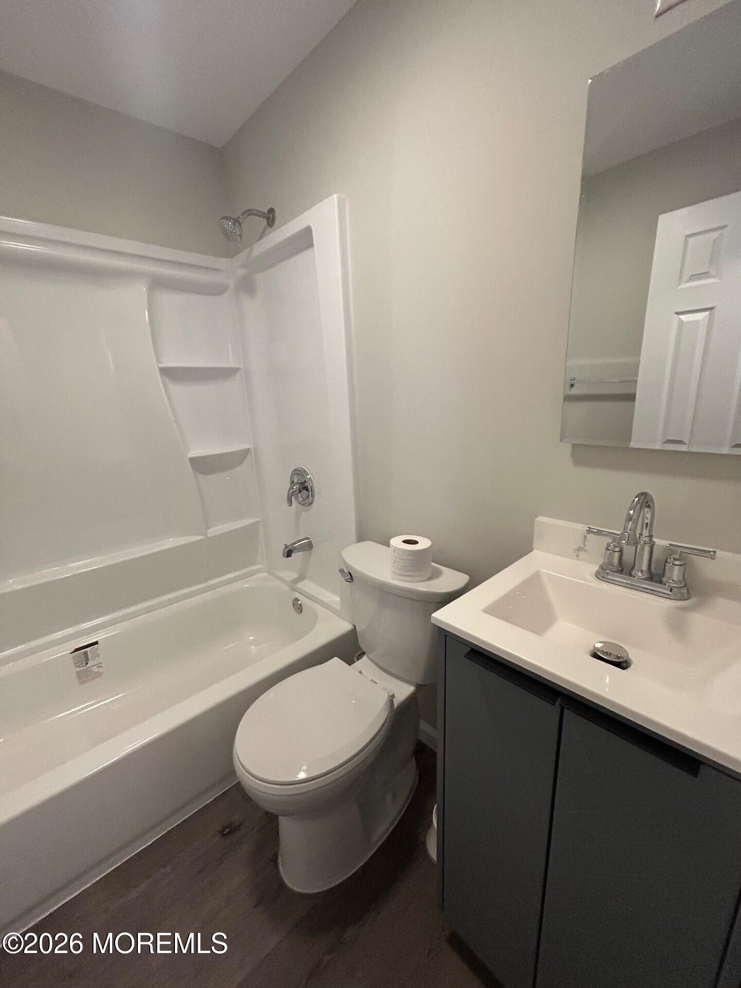 2 Peninsula Avenue Sea Bright, NJ 07760 - Photo 4 of 7 a bathroom with a toilet a sink and a bathtub