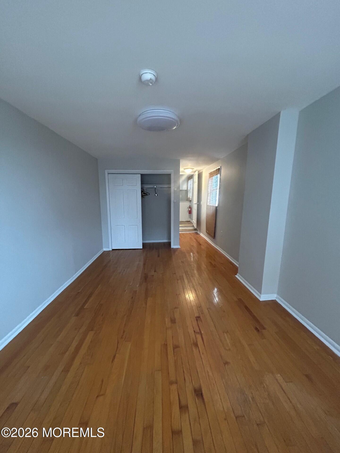 2 Peninsula Avenue Sea Bright, NJ 07760 - Photo 7 of 7 a view of empty room with wooden floor