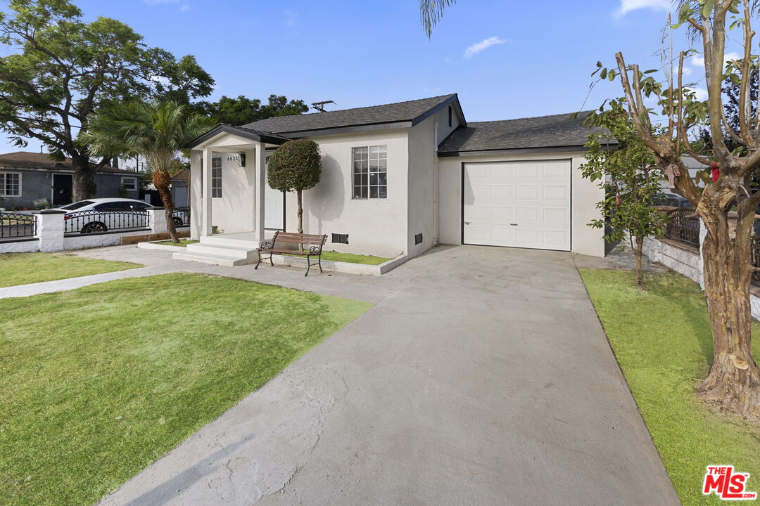 6833 Crafton Avenue Bell, CA 90201 - Photo 4 of 33 a view of a house with backyard and sitting area