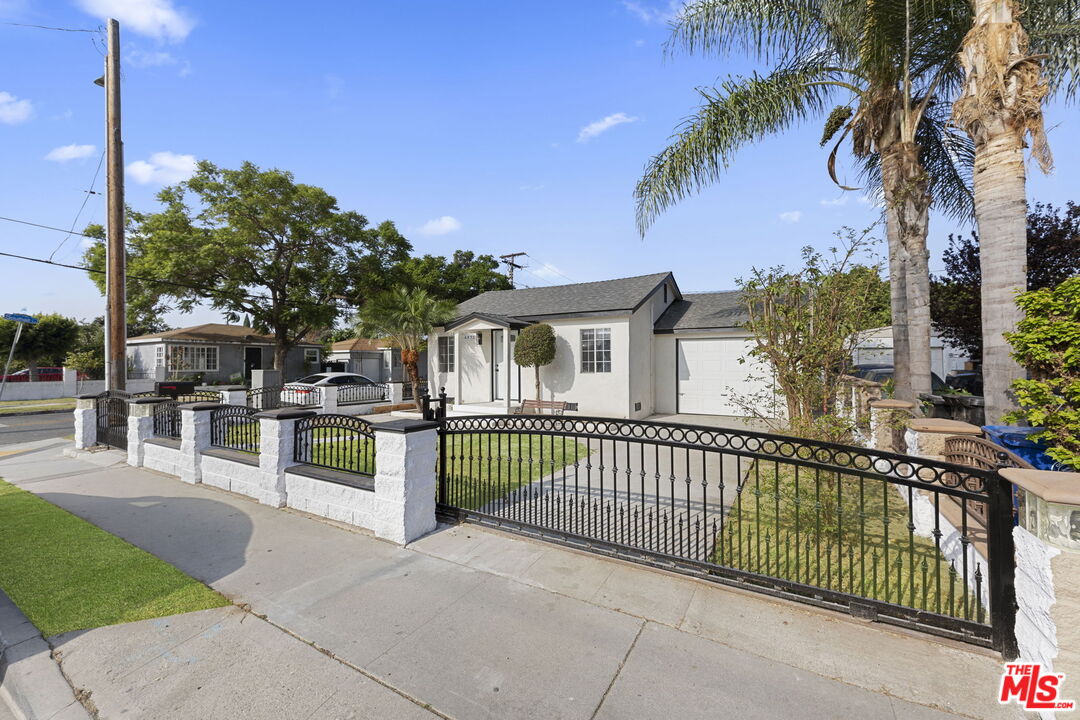 6833 Crafton Avenue Bell, CA 90201 - Photo 5 of 33 a view of a house with a small yard