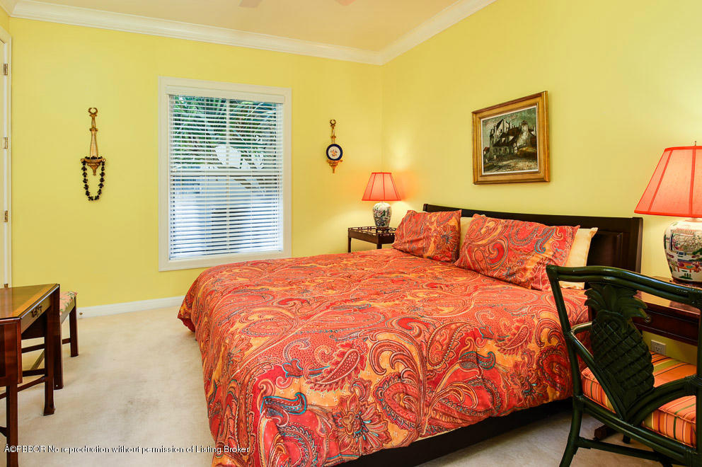 1680 Lands End Road Manalapan, FL 33462 - Photo 13 of 15 a bedroom with a bed and wooden floor