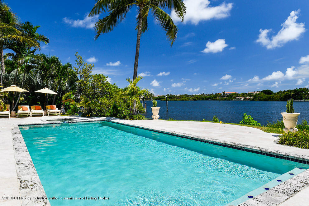 1680 Lands End Road Manalapan, FL 33462 - Photo 3 of 15 a view of a house with swimming pool and a yard