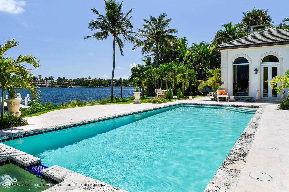 1680 Lands End Road Manalapan, FL 33462 - Photo 4 of 15 a view of swimming pool with a table and chairs