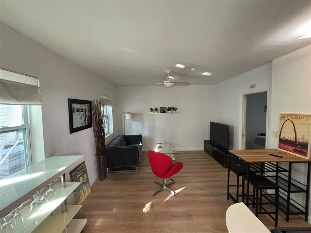 1315 Southeast 2nd Street, Unit REAR EAST Fort Lauderdale, FL 33301 - Photo 3 of 12 a living room with furniture and wooden floor