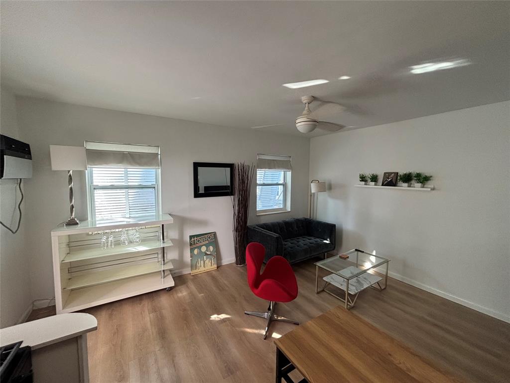 1315 Southeast 2nd Street, Unit REAR EAST Fort Lauderdale, FL 33301 - Photo 4 of 12 a living room with furniture and wooden floor