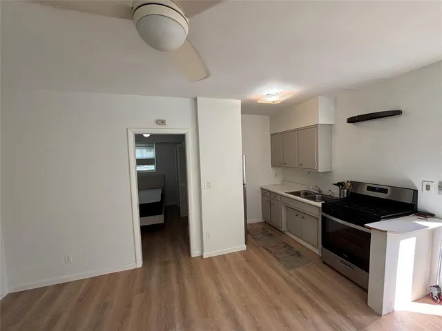 a kitchen with stainless steel appliances granite countertop a stove and a refrigerator