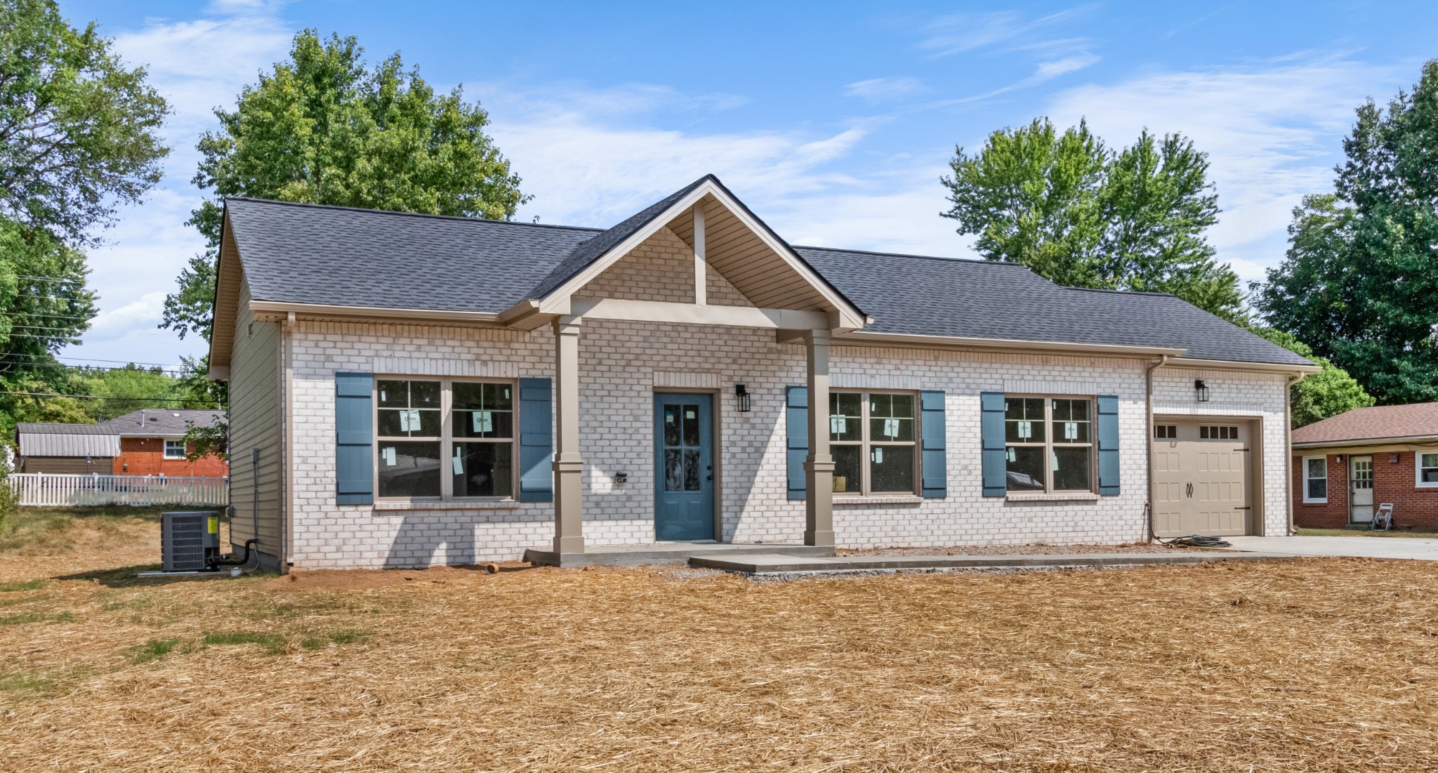 front view of a house with a yard