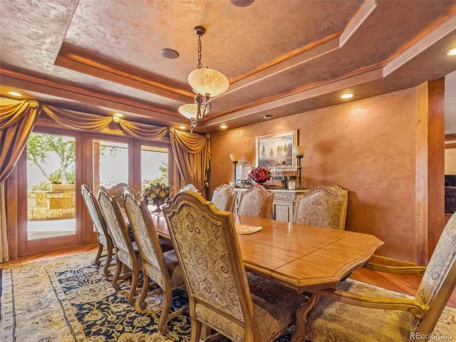 a view of a dining room with furniture window and outside view