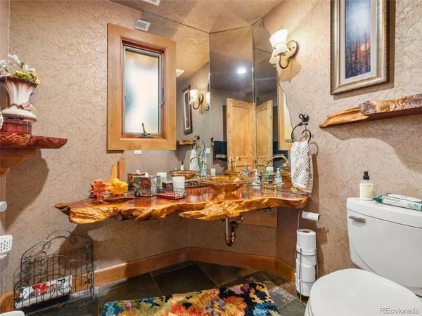 a bedroom with a bed couch and a window