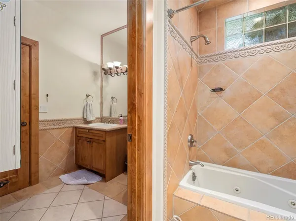 a bedroom with a bed and large window