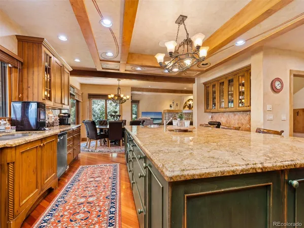 a large kitchen with a table and chairs in it