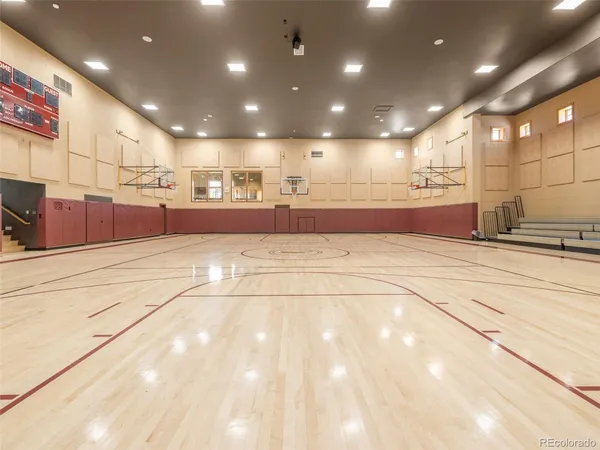 a kitchen with stainless steel appliances granite countertop a sink a refrigerator and a stove