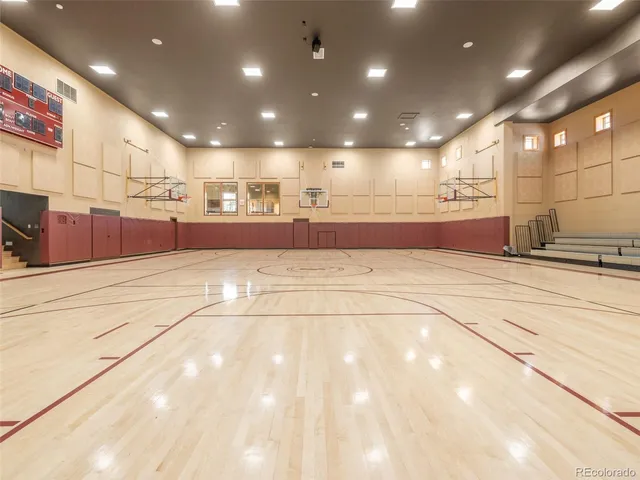 a kitchen with stainless steel appliances granite countertop a sink a refrigerator and a stove