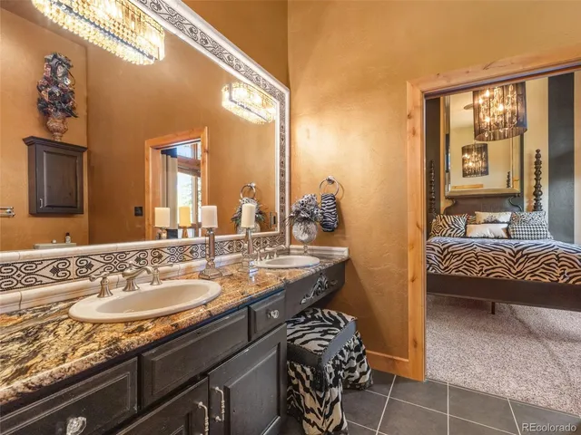 a kitchen with stainless steel appliances granite countertop a stove a sink dishwasher and a microwave oven with cabinets