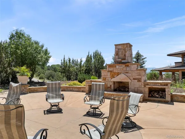 an aerial view of a house with a mountain