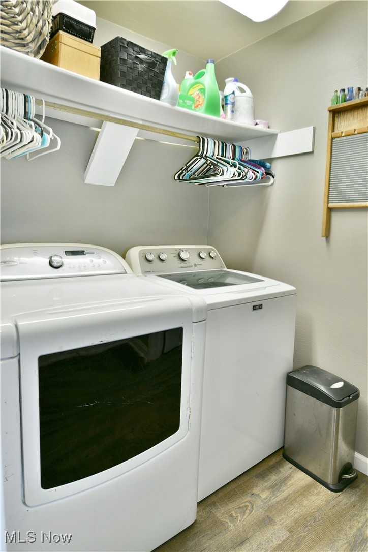 600 Prentice Road Northwest Warren, OH 44481 - Photo 24 of 47 Laundry room featuring light wood-type flooring and washer and clothes dryer