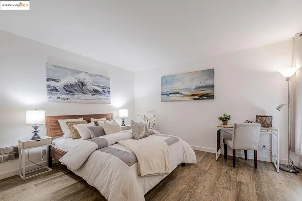 a bedroom with bed and a table